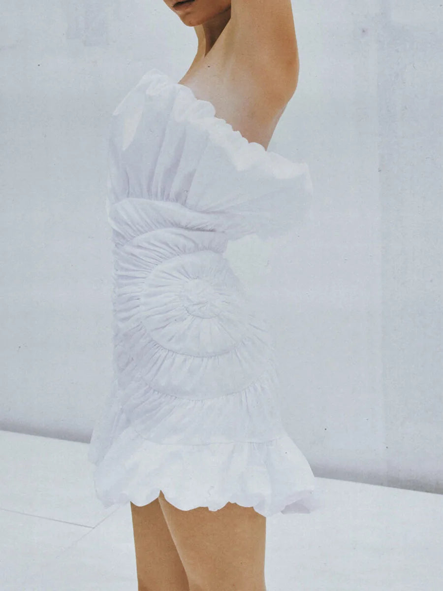 Structured strapless white dress with shell-inspired design