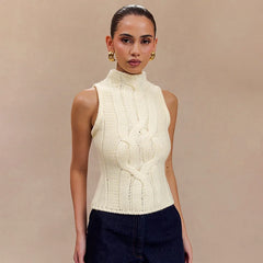 A woman wearing a semi high-neck sleeveless sweater vest in a loose-fitting silhouette.