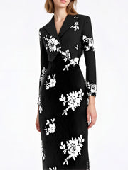 Model wearing a black sequin lapel top and high-waist skirt set, standing against a clean studio background.