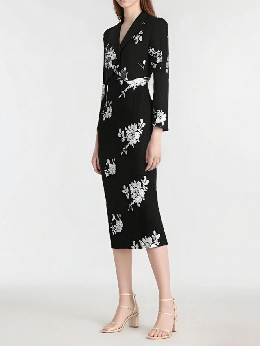 Black sequin top and skirt set styled for an elegant evening look with minimal accessories.