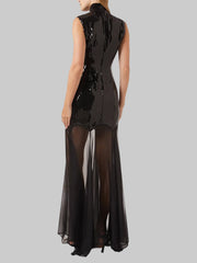 A close-up of the sequin patchwork and mesh detail on the dress.