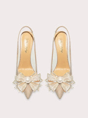 a sequin sandal with a pearl bow and a thin heel.