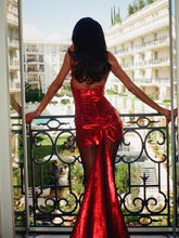 A woman wearing a sequined bow mini dress in a chic, modern style.