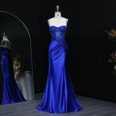 Front view of a floor-length satin prom dress with sweetheart neckline and draped waist detail