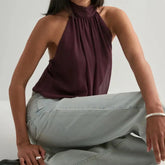 A front view of a sexy backless summer vest, highlighting the neckline.