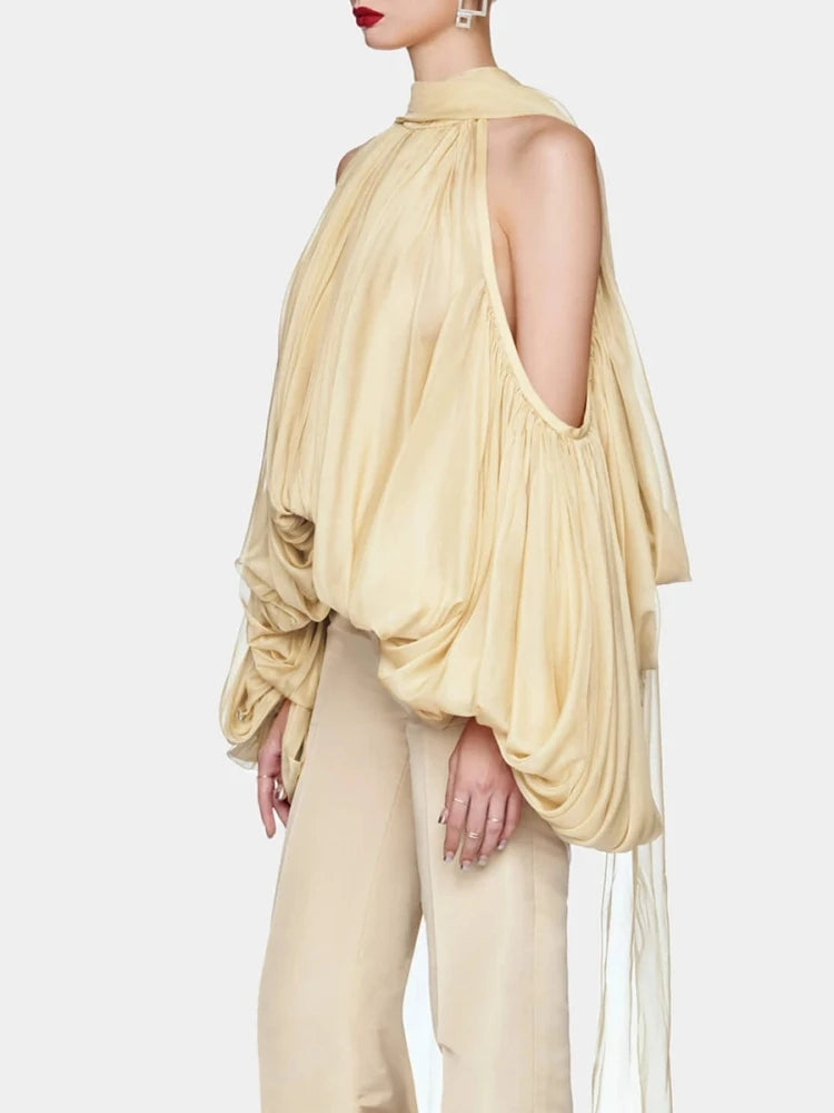 A full-length shot of a sexy halter top styled for an evening party.