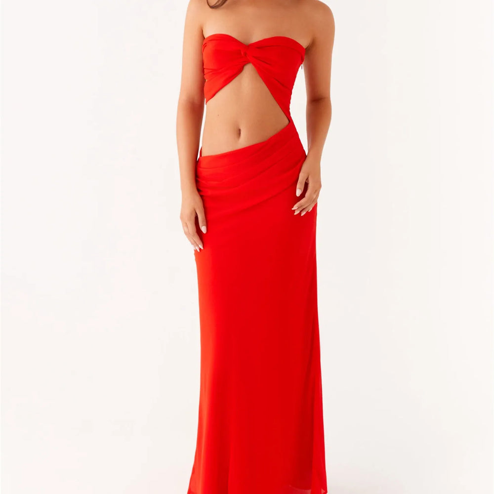 A sexy strapless club party bandeau dress styled with heels and a clutch.