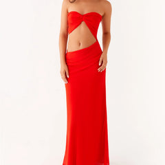 A sexy strapless club party bandeau dress styled with heels and a clutch.