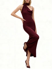 A slim sheath evening dress with understated elegance and relaxed evening stance in a minimalist studio.