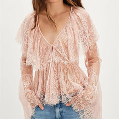 A close-up of the sheer fabric and texture of the top.