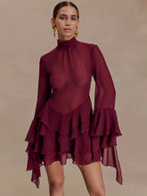 Sheer mesh mini dress with high neckline and tiered ruffle skirt
