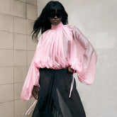 Sheer pleated turtleneck top with voluminous lantern sleeves