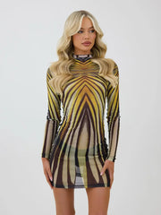 Woman wearing a sheer psychedelic print turtleneck mini dress on a plain background