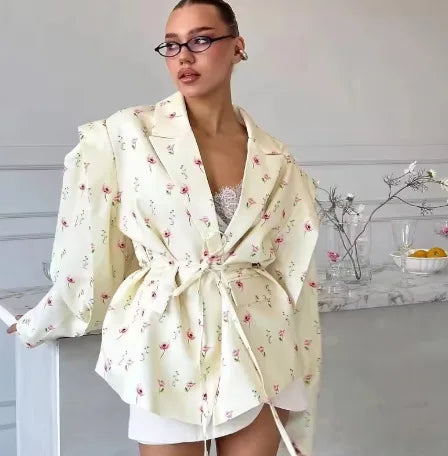 Side view of floral blazer showing soft shoulder and curved fit