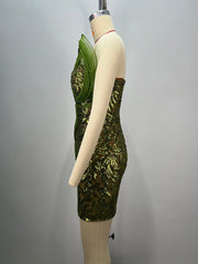 Side view - structured evening mini gown in green for parties on a mannequin against a grey background
