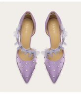 a silk sandal with a crystal and lace design and a thin heel.