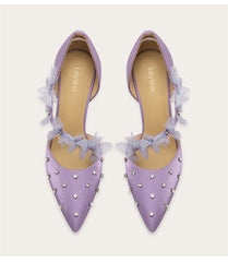 a silk sandal with a crystal and lace design and a thin heel.