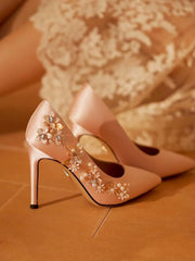 Front view of women’s silk pearl rhinestone pointed toe heels