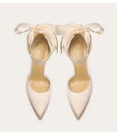 a silk pump with a ribbon-bow design and a thin heel.