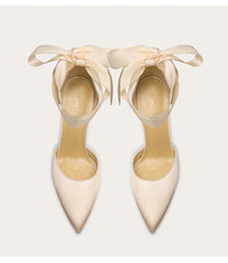 a silk pump with a ribbon-bow design and a thin heel.