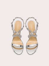 Silver chain embellished party sandals styled for modern celebration