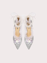 Silver floral bow party sandals styled for weddings and celebrations