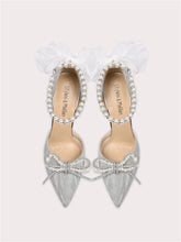 Silver pearl bow party sandals styled for weddings and glamour events