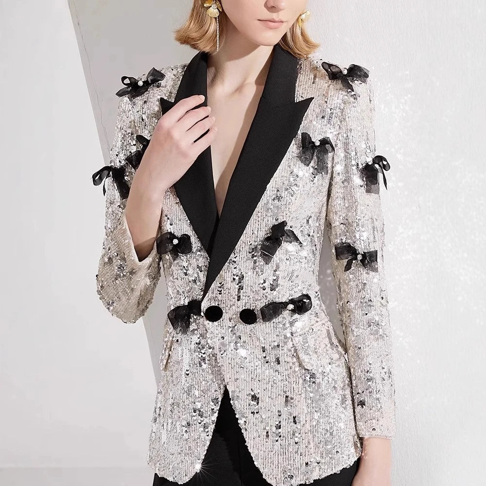 Silver sequin blazer with bow details styled with matching pants