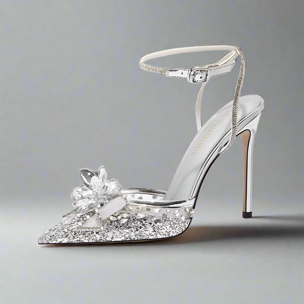 Silver mesh stiletto sandal with sequin and crystal bow designed for bridal events on a white background