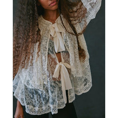 The slash-neck floral top is styled casually with jeans.