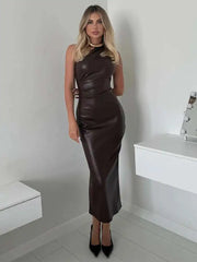 Sleek one shoulder party dress for women, styled in a dimly lit lounge