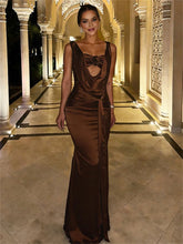 Formal sleeveless gown featuring a flowing silhouette and natural waist