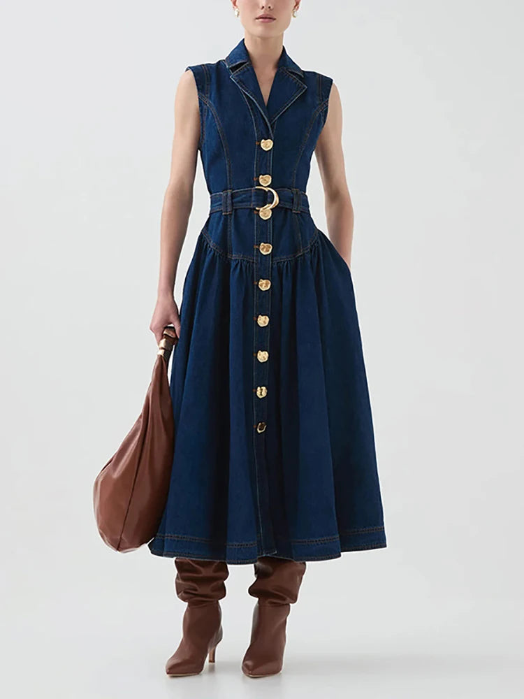 Sleeveless navy midi dress with gold button and detachable belt styled for office days