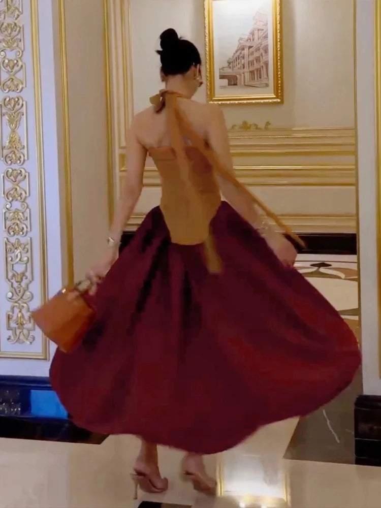 The dress showing the fit-and-flare silhouette and backless detail.