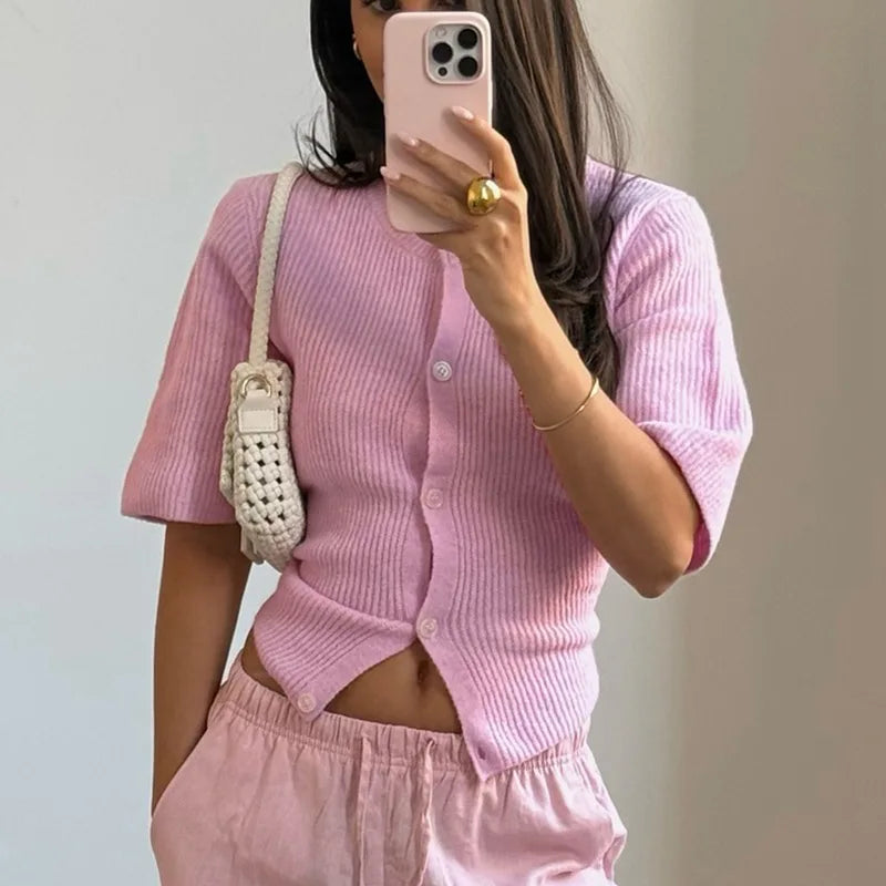 A full-length shot of a slim-fit casual sweater top styled for a day at the office.