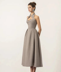 The slim fit of the dress, highlighting its flattering silhouette.