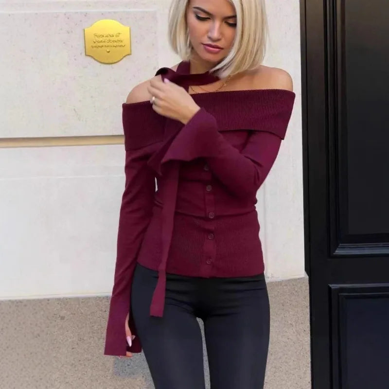 The slim silhouette of the knit top, highlighting its flattering fit.