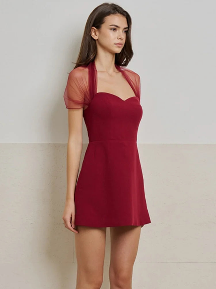 Full-length view highlighting the slim, stretch knit fit through the waist and hips, finishing in a neat above-knee hemline.