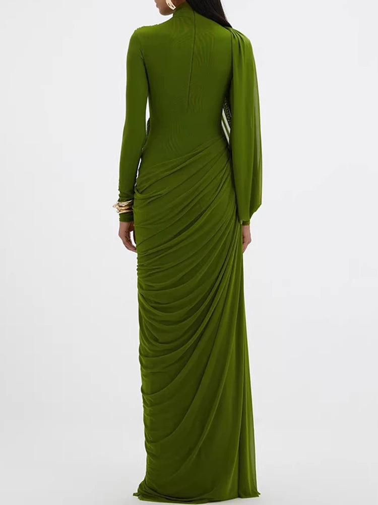 Full-length view highlighting the slim, floor-length silhouette and long sleeves, with fabric falling smoothly to the hem in a sleek line.