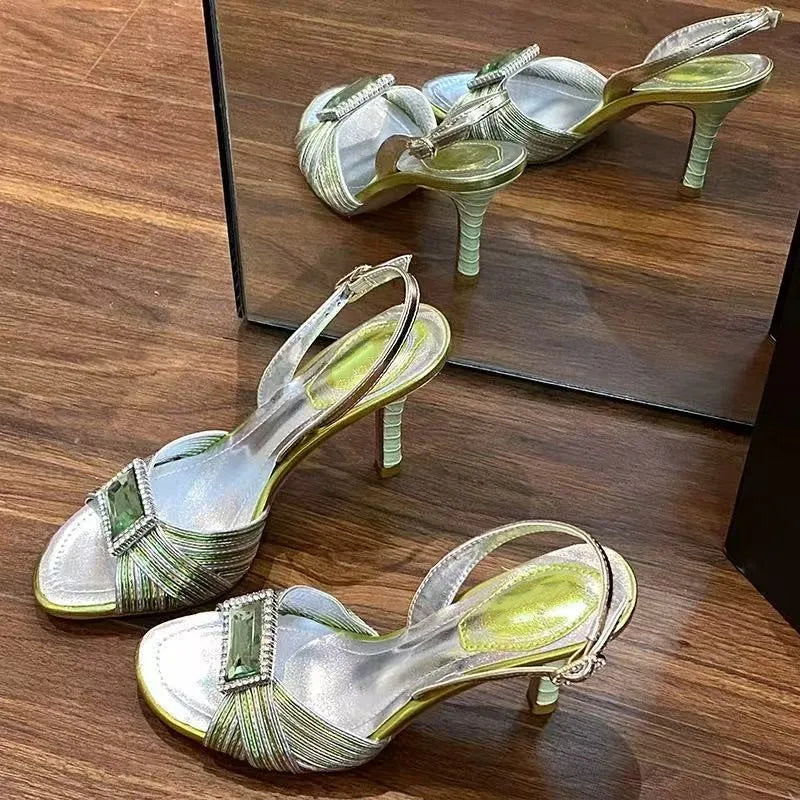 Slingback stiletto heel with green buckle styled for parties
