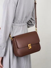 Leather crossbody with secure zipper and hasp closure detail