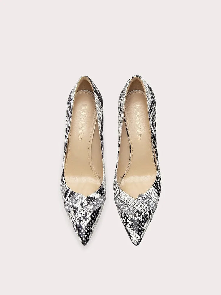 A close-up of the snake print and crystal detail on the shoe.