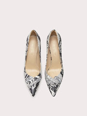 A close-up of the snake print and crystal detail on the shoe.