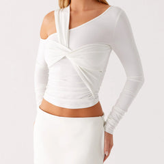 A front view of a solid-color casual blouse, highlighting the unique neckline.