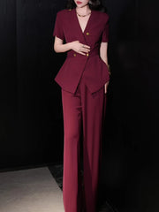 A woman modeling a solid two-piece set with a V-neck top and a pair of high-waist pants.