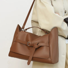 Spacious leather bag paired with daily commute outfits for women