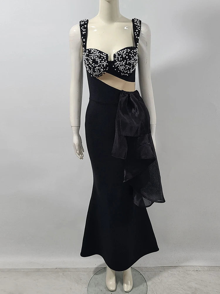 Spaghetti strap black gala dress styled for upscale formal events