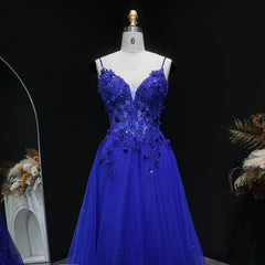 Floor-length A-line tulle gown with open-back detail and spaghetti straps