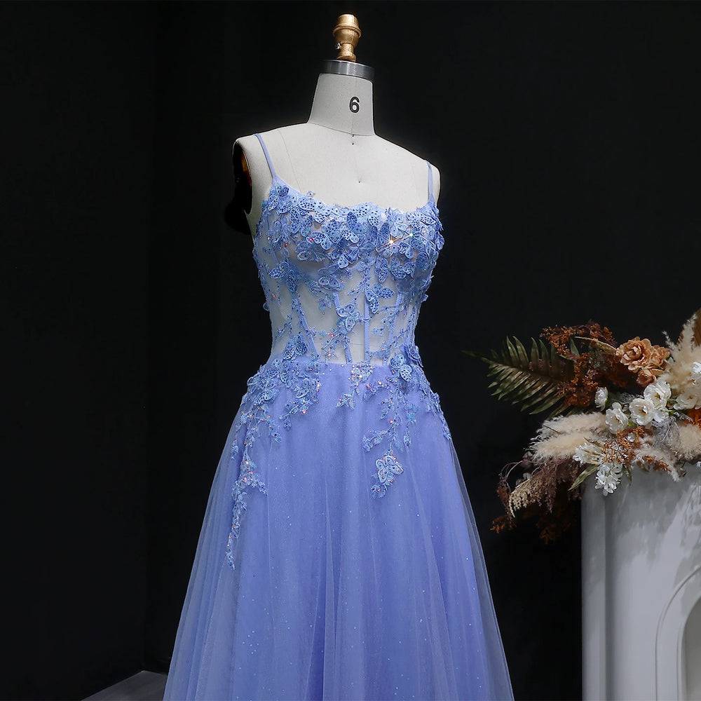 Floor-length A-line tulle gown with open-back detail and slim straps