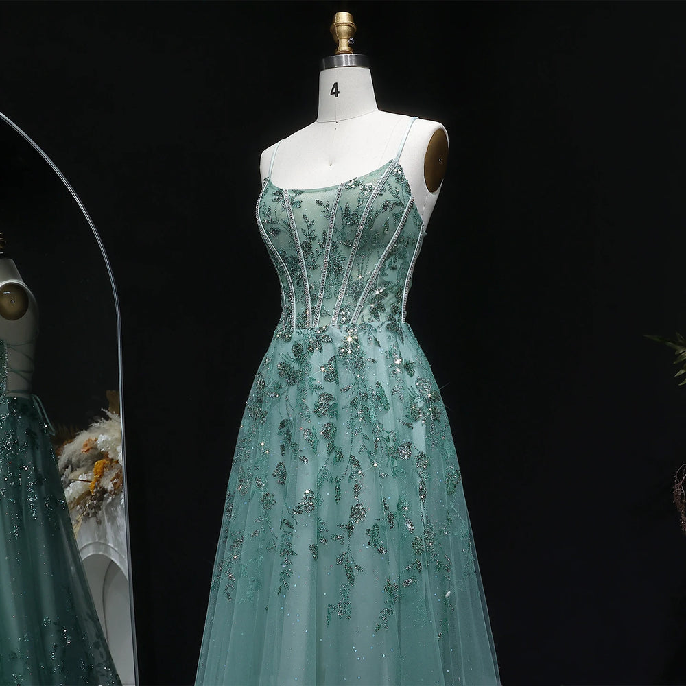 Floor-length A-line tulle gown with open-back detail and slim straps